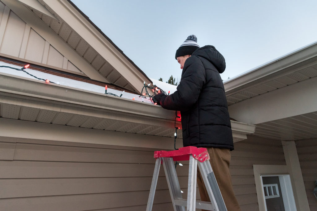 hanging Christmas lights on gutters